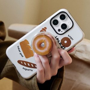Hand holding the bagel case at an angle over a tweed jacket, the bagel holder facing the camera