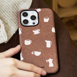 The brown case held low with its printed cups and moka pots in view, holder removed