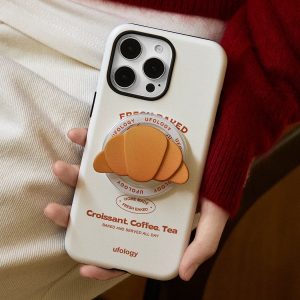 The case held at the hip, burnt-orange lettering and croissant holder in view