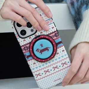 Fair isle case tilted to show the red ring holder and blue disc