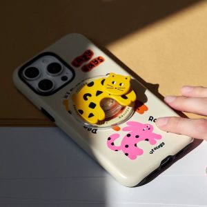 Spotted cat and rabbit case lying on a pale table in sunlight