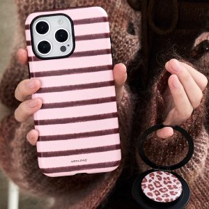 The striped case held beside the leopard-print holder detached from its magnetic ring