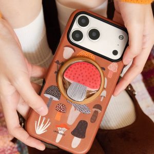 Mushroom iPhone case held in both hands showing the toadstool holder