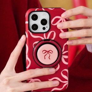Red case with pink bows held up, showing the folded ring holder