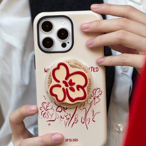 Bone-white floral case held against a white shirt and dark jacket