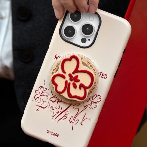 Close view of the molded red flower on the magnetic holder