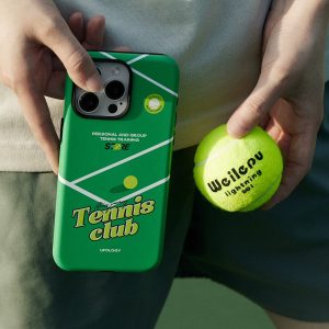 Green tennis case held in one hand next to a tennis ball, showing the case on its own