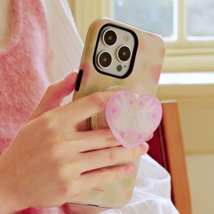 Heart-shaped rabbit holder gripped between two fingers