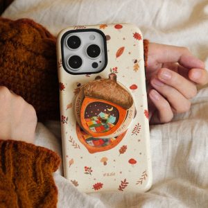 Acorn grip on the back of a cream case printed with autumn leaves