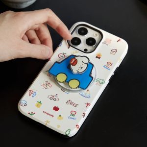 Blue car holder being clipped onto the cream doodle iPhone case on a dark table