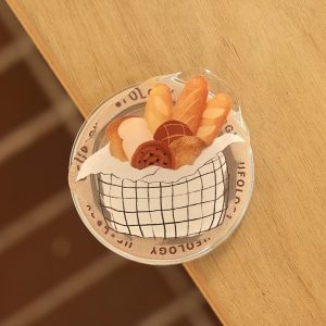 Bread basket grip leaning on the edge of a wooden table