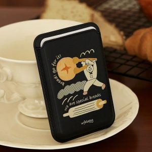 Bread MagSafe wallet, a black card wallet with a baker carrying a baguette in cream line art – styled shot