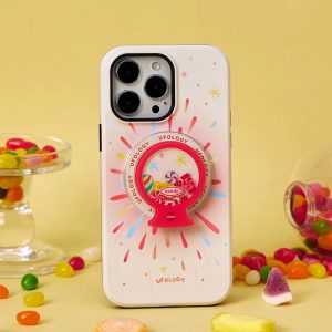Cream starburst case with gumball holder standing among jelly beans