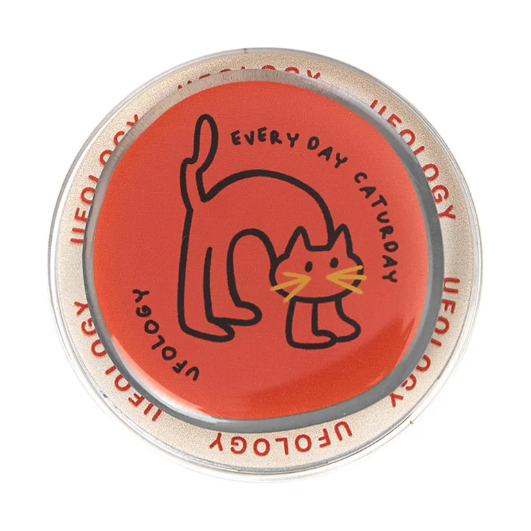 Caturday cat MagSafe phone grip, a black line cat stretching on a red Every Day Caturday disc