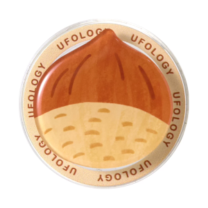 Chestnut MagSafe phone grip, a glossy roasted chestnut on a round cream base