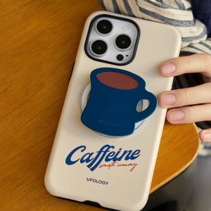 Coffee mug grip attached to a cream phone case with blue Caffeine lettering