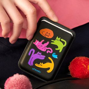Five cats MagSafe wallet, a black card wallet printed with five bright stretching cats – styled shot