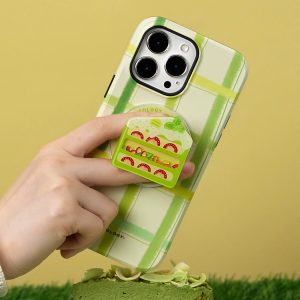 Matcha cake grip on the back of a green check phone case