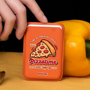 Pizza MagSafe wallet, an orange card wallet with a pizza slice and red Pizzatime lettering – styled shot