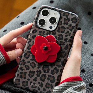Red blossom grip on the back of a gray leopard print phone case