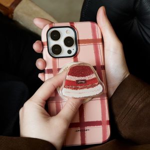 Red velvet cake grip on the back of a pink and red plaid phone case