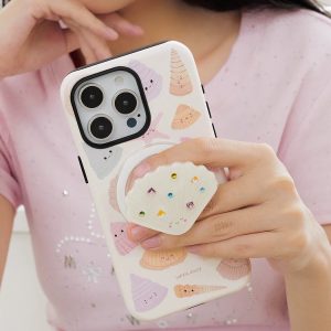 Seashell grip on the back of a pastel phone case printed with shells