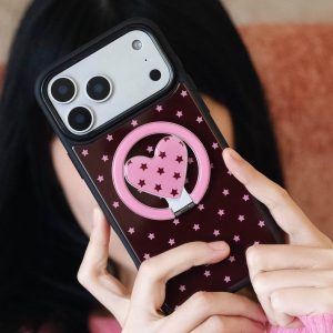Starry heart grip on the back of a dark polka dot phone case