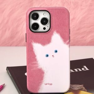 White cat case standing upright on a book against a fluffy pink backdrop